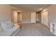 Expansive bonus room with soft carpeting and lots of entryways and doorways at 3419 Mulberry Cove Way, Auburn, GA 30011