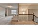Spacious bonus room with plush carpeting and staircase at 3419 Mulberry Cove Way, Auburn, GA 30011