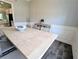 Dining room features gray wood floors, decorative trim and a table for six at 3419 Mulberry Cove Way, Auburn, GA 30011