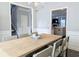 Elegant dining room with decorative trim and a view into the adjacent living spaces at 3419 Mulberry Cove Way, Auburn, GA 30011