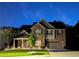 Beautiful two-story brick home with a well-manicured lawn and tasteful landscaping at 3419 Mulberry Cove Way, Auburn, GA 30011