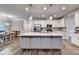 Bright kitchen featuring white cabinets, stainless steel appliances, and spacious granite island at 3419 Mulberry Cove Way, Auburn, GA 30011