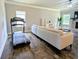 Spacious living room featuring a sofa, treadmill, and plenty of natural light at 3419 Mulberry Cove Way, Auburn, GA 30011