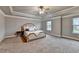 Main bedroom suite features tray ceiling and ample natural light at 3419 Mulberry Cove Way, Auburn, GA 30011