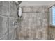 The shower is fully tiled and features both standard and rain shower heads at 3419 Mulberry Cove Way, Auburn, GA 30011