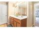 Bathroom featuring a double vanity with cabinetry, large mirror, and modern fixtures at 198 Britt Dr, Lawrenceville, GA 30046