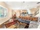 Open-concept living area featuring hardwood floors, large windows, and comfortable seating with decorative pillows at 198 Britt Dr, Lawrenceville, GA 30046