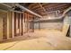 Unfinished basement with concrete floor, concrete walls and exposed duct work at 1373 Janice Sw Ct, Lilburn, GA 30047