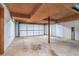 Unfinished basement with garage door perfect for storage or a workshop at 1373 Janice Sw Ct, Lilburn, GA 30047