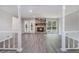 Spacious living room features a stone fireplace, hardwood floors, and large windows for plenty of natural light at 1373 Janice Sw Ct, Lilburn, GA 30047