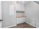 A storage room with built in shelves and gray flooring at 1373 Janice Sw Ct, Lilburn, GA 30047