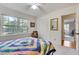 Bright bedroom with windows offering backyard views and double door closet at 1631 Manhasset Dr, Atlanta, GA 30338