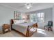Bedroom featuring cool paint, a wooden bed frame, and a window at 1631 Manhasset Dr, Atlanta, GA 30338
