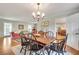 Open-concept dining area offers a view to the living room, hardwood floors, and natural light at 1631 Manhasset Dr, Atlanta, GA 30338