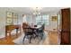 Elegant dining room boasts hardwood floors, classic decor, and a cozy atmosphere for meals at 1631 Manhasset Dr, Atlanta, GA 30338