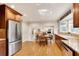 Stylish kitchen boasts stainless steel appliances, granite counters, and a view to breakfast nook at 1631 Manhasset Dr, Atlanta, GA 30338