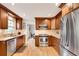 Modern kitchen with stainless steel appliances, granite countertops, and wooden cabinets at 1631 Manhasset Dr, Atlanta, GA 30338