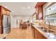 Spacious kitchen with granite countertops, stainless steel appliances, and an open view to the breakfast area at 1631 Manhasset Dr, Atlanta, GA 30338