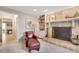Comfortable living room featuring stone fireplace and tile flooring beyond the doorway at 1631 Manhasset Dr, Atlanta, GA 30338