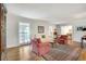 Bright and airy living room with hardwood floors, plush seating, and large windows for natural light at 1631 Manhasset Dr, Atlanta, GA 30338