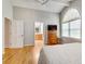 Bright main bedroom with hardwood floors and ensuite bathroom access at 1631 Manhasset Dr, Atlanta, GA 30338
