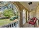 Covered porch with brick arches and outdoor seating, perfect for relaxation at 1631 Manhasset Dr, Atlanta, GA 30338