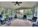 Relaxing screened porch with comfortable seating and views of the backyard gazebo at 1631 Manhasset Dr, Atlanta, GA 30338