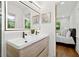 Well-lit bathroom with dual sink vanity near bedroom, offering convenient access at 1737 Briarlake Cir, Decatur, GA 30033