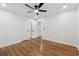 Light bedroom boasts gleaming hardwood floors and white doors, creating a clean aesthetic at 1737 Briarlake Cir, Decatur, GA 30033