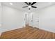 Light bedroom boasts gleaming hardwood floors and white doors, creating a clean aesthetic at 1737 Briarlake Cir, Decatur, GA 30033
