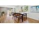 Dining area featuring a wooden table, stylish chairs, hardwood floors and bright windows at 1737 Briarlake Cir, Decatur, GA 30033