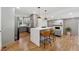 Modern kitchen with stainless steel appliances, quartz countertops and a large breakfast bar at 1737 Briarlake Cir, Decatur, GA 30033