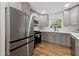 Beautiful kitchen with stainless steel appliances, quartz counters, and modern cabinetry at 1737 Briarlake Cir, Decatur, GA 30033