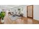 Spacious living room featuring hardwood floors, natural lighting, and seamless access to the dining area at 1737 Briarlake Cir, Decatur, GA 30033