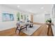 Inviting living room featuring hardwood floors, a large window, and a stylish decor at 1737 Briarlake Cir, Decatur, GA 30033