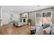 Bright living room featuring hardwood floors, a cozy fireplace, and a sliding glass door to the exterior at 1737 Briarlake Cir, Decatur, GA 30033