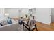 Comfortable living room with hardwood floors, a neutral sofa set, and a charming decorative plant at 1737 Briarlake Cir, Decatur, GA 30033