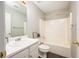 A clean bathroom with a single sink vanity, toilet, and shower/tub combo at 3140 Ennfield Ln, Duluth, GA 30096