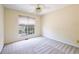 Bedroom with neutral paint, carpet, and a large window at 3140 Ennfield Ln, Duluth, GA 30096