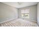 Bedroom features neutral paint, carpet, and natural light at 3140 Ennfield Ln, Duluth, GA 30096