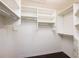 A walk-in closet with built-in shelving and wooden floor provides ample storage space at 3140 Ennfield Ln, Duluth, GA 30096