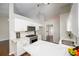 Bright kitchen with white cabinets, marble countertops, and stainless steel appliances at 3140 Ennfield Ln, Duluth, GA 30096