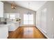 Bright, eat-in kitchen features a breakfast bar and large sun-filled windows at 3140 Ennfield Ln, Duluth, GA 30096
