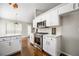 Bright kitchen with white cabinets, eat-in breakfast area, and stainless steel appliances at 3140 Ennfield Ln, Duluth, GA 30096