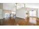 Open floor plan with wood floors leads to the kitchen and staircase at 3140 Ennfield Ln, Duluth, GA 30096
