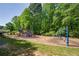 Community playground featuring various play structures, swings, and a safe, grassy area for children to enjoy at 3140 Ennfield Ln, Duluth, GA 30096