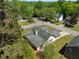 Aerial view of a home nestled among mature trees in a residential neighborhood at 7171 Hazelwood Dr, Jonesboro, GA 30236