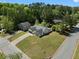 An aerial view of a spacious suburban home with mature trees and a large, well-kept lawn at 7171 Hazelwood Dr, Jonesboro, GA 30236