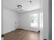 Empty bedroom with hardwood floors, a window, and natural light at 7171 Hazelwood Dr, Jonesboro, GA 30236