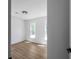 Empty bedroom with plenty of natural light and hardwood flooring at 7171 Hazelwood Dr, Jonesboro, GA 30236